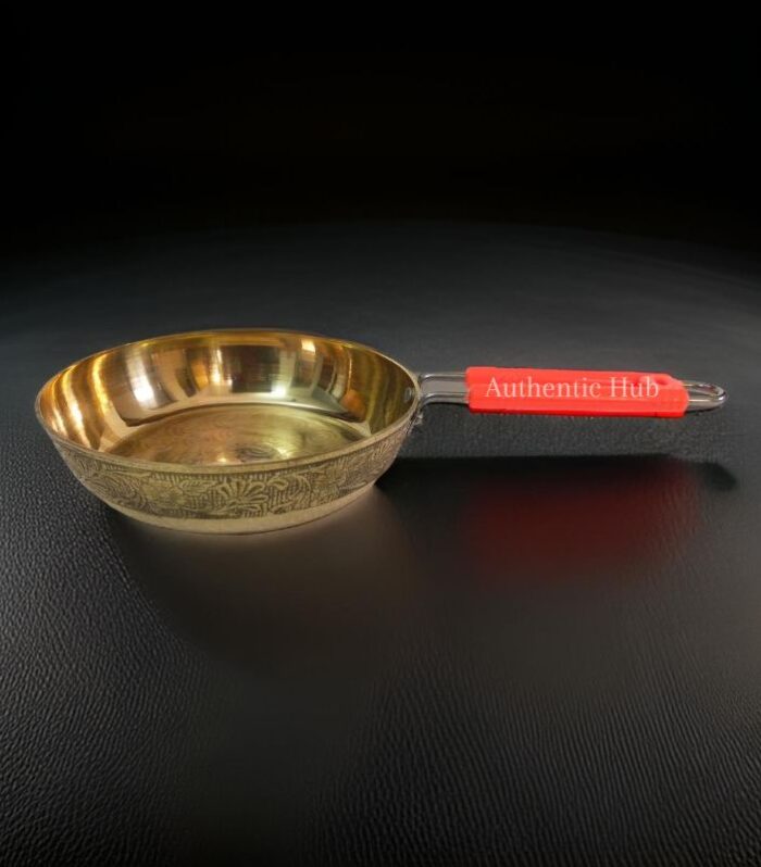 Small brass fry pan with red handle